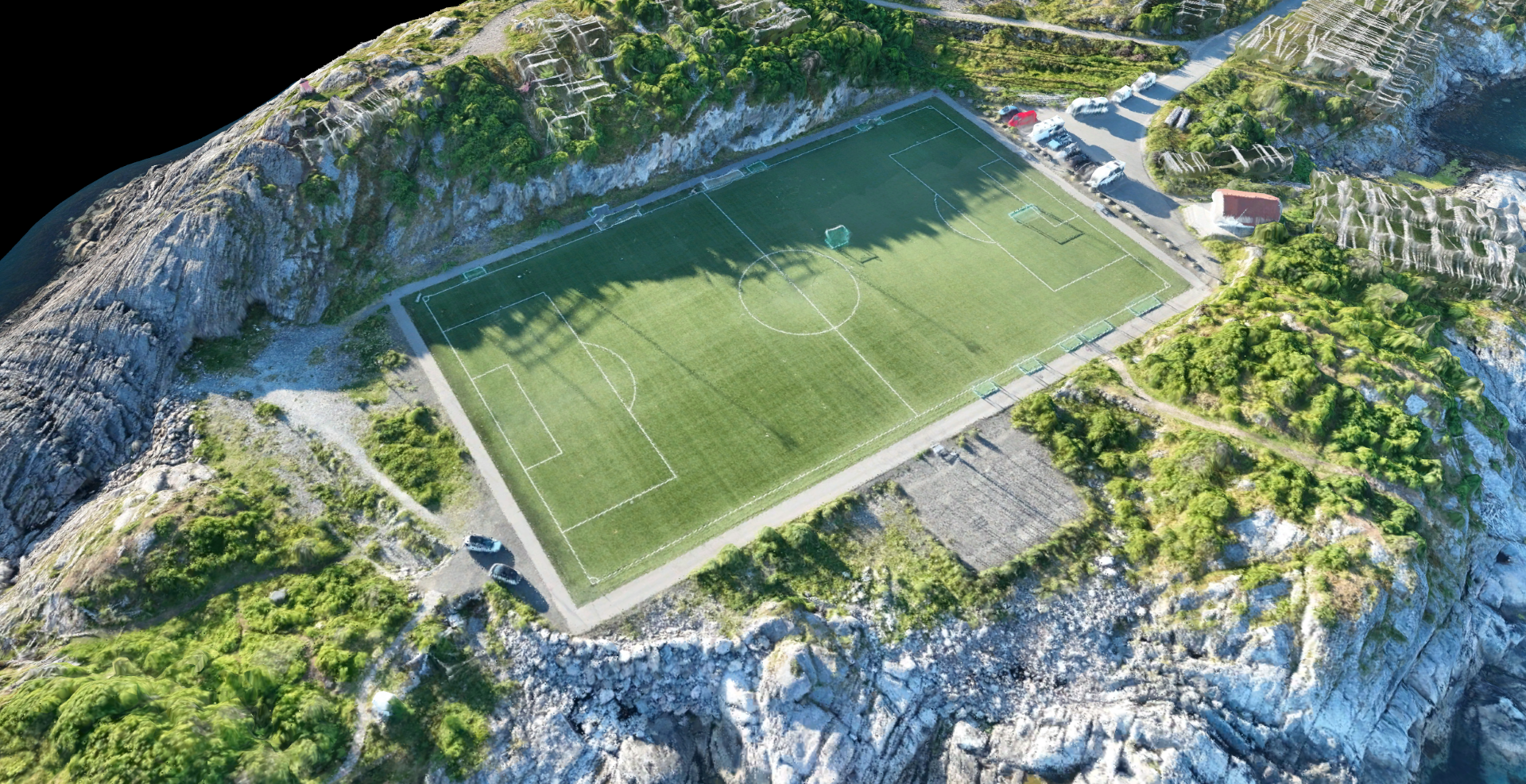 Detailed 3D mesh model of a soccer field captured through drone surveying, showing precise topographical features and infrastructure mapping capabilities