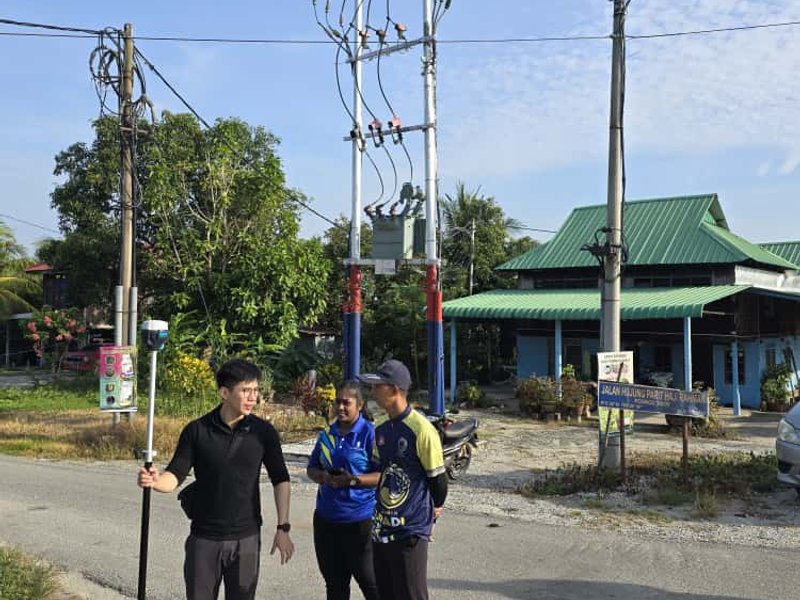 Dronify team conducting field survey with RTK GPS equipment